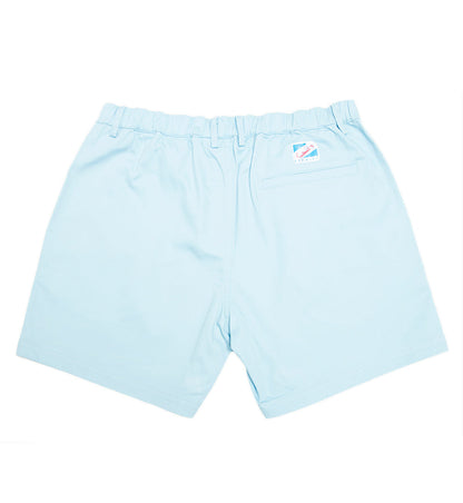 Blue cotton swim shorts by Ruby Tartarus, shown with relaxed fit and elastic waistband, perfect for casual beachwear.
