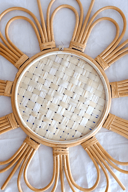 Start2Finish flower rattan mirror with a round frame and intricate woven design, suitable for wall decor.
