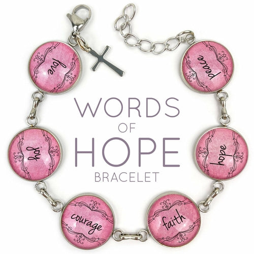 Pink bracelet featuring glass charms with words of hope like love, joy, courage, faith, hope, and peace by Orchid Briseis.