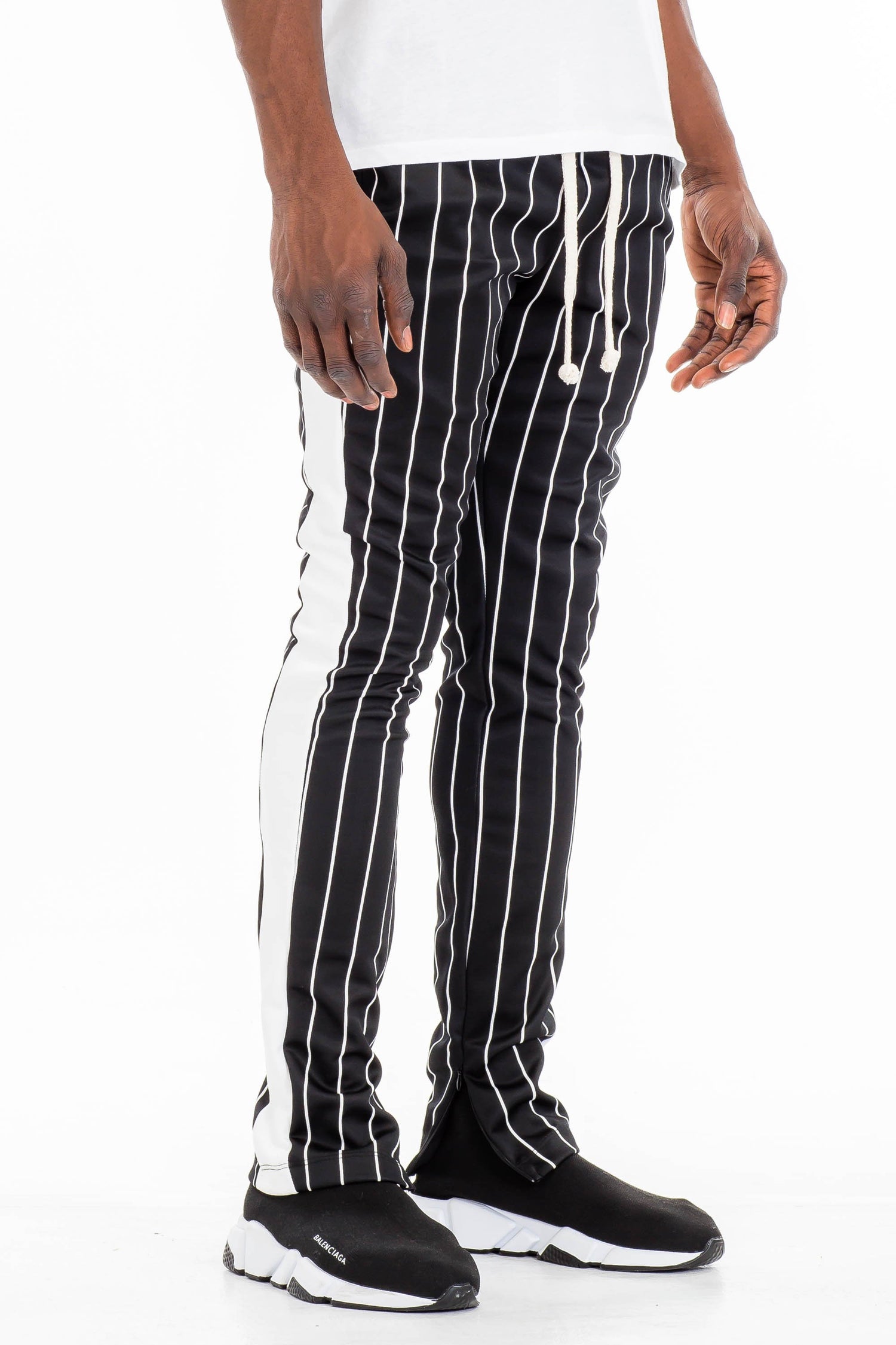 Lime Milo pin stripe track pants with an elastic waistband and tapered fit, featuring classic pinstripe pattern.