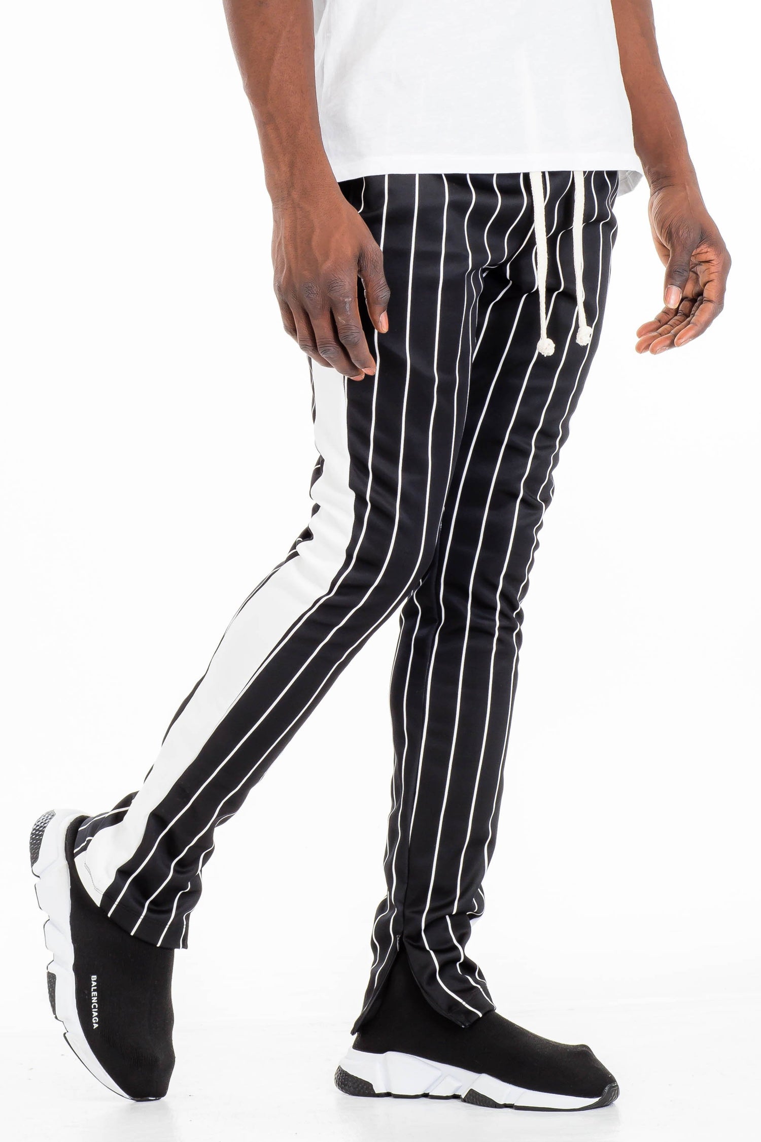 Lime Milo pin stripe track pants with an elastic waistband and tapered fit, featuring classic pin stripe pattern and side pockets.