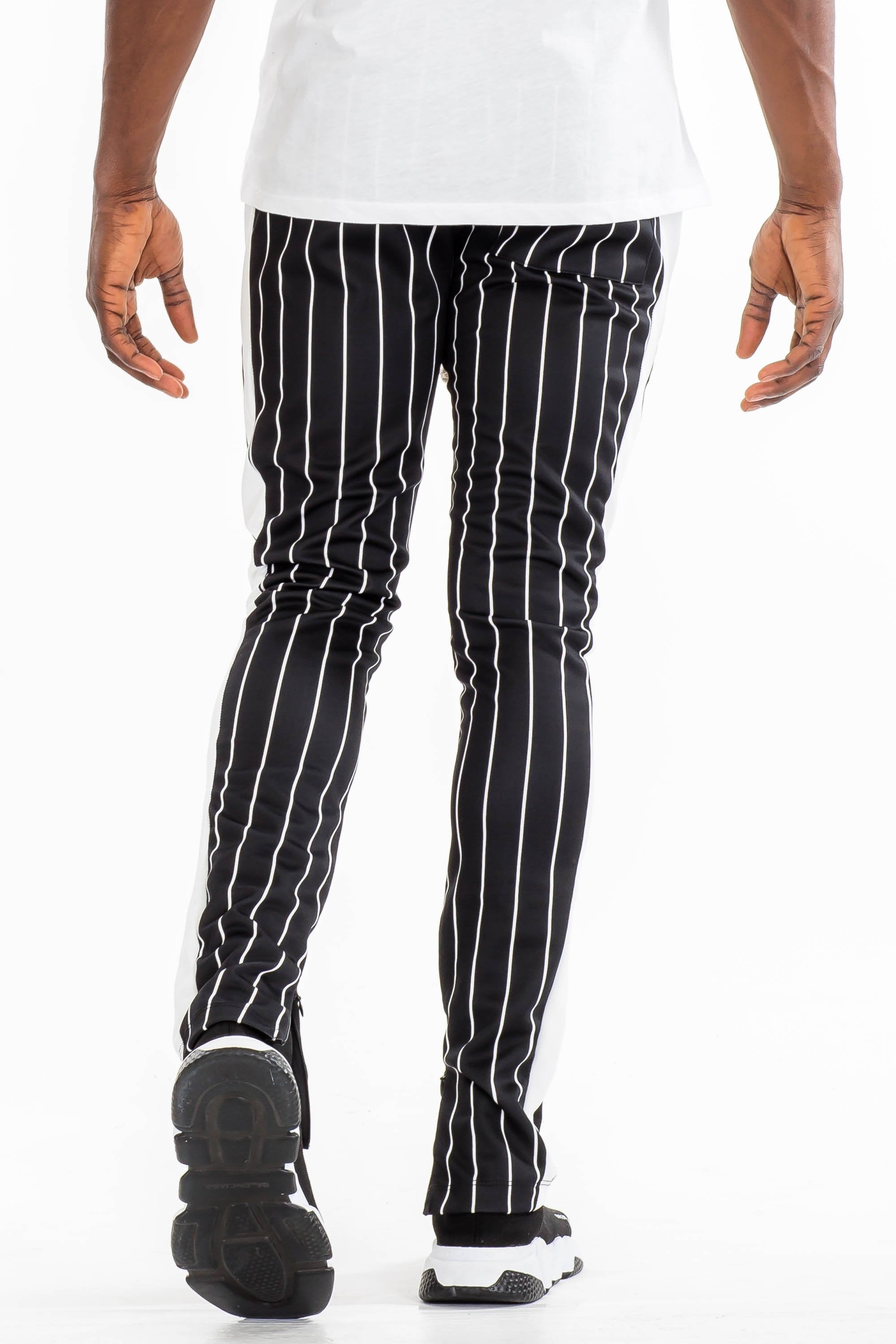 Lime Milo pinstripe track pants with a relaxed fit and elastic waistband, featuring vertical white pinstripes on navy fabric.