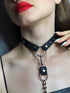 Black BDSM choker collar with metal ring details, worn as a stylish women’s fashion accessory by Harlequin Icarus.