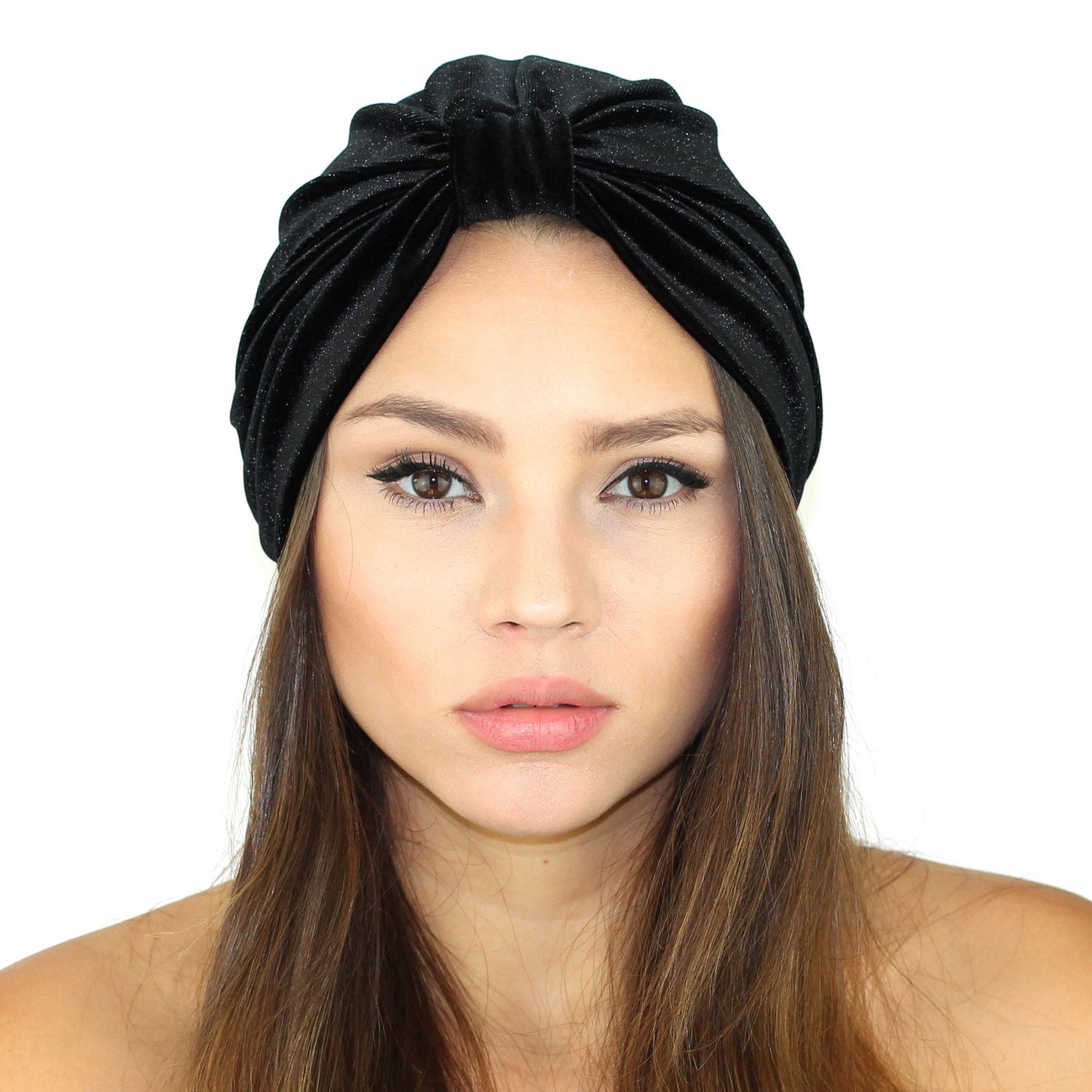 Black stretch velvet turban by Cyan Ismene, soft haircare accessory with a smooth, fitted design for comfortable wear.