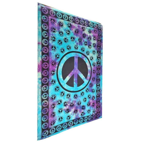 Blue tie-dye tapestry with a peace sign design, wall hanging coverlet from Silver Hestia, ideal for boho decor and wall decor.