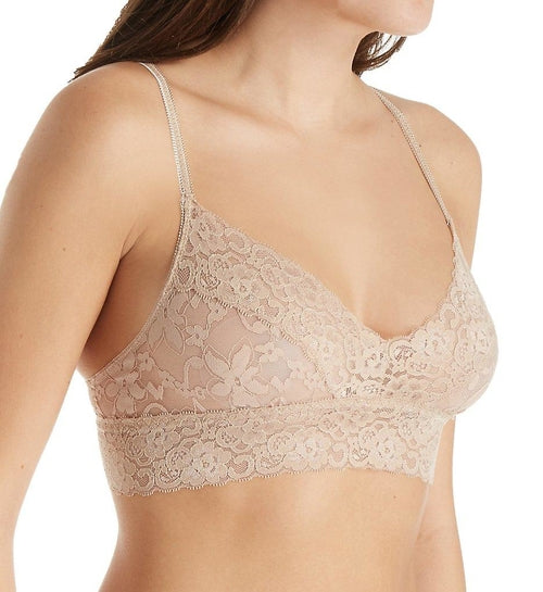 Beige semi-sheer lace bralette by Melanter, featuring delicate floral lace details and adjustable straps.