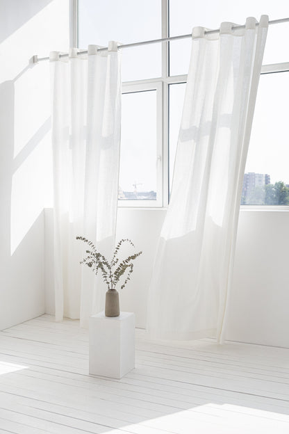 Light grey linen curtain with grommets from Magenta Sugarplum, featuring a soft, textured fabric for elegant home decor.