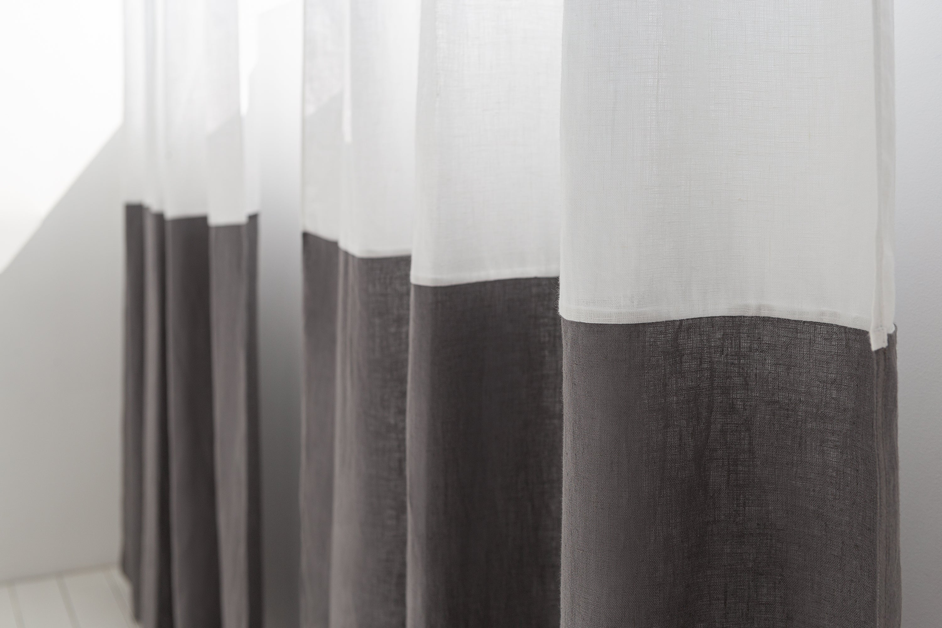 White and pastel plum linen curtains with tape, two-tone Magenta Sugarplum home decor window treatments hanging indoors
