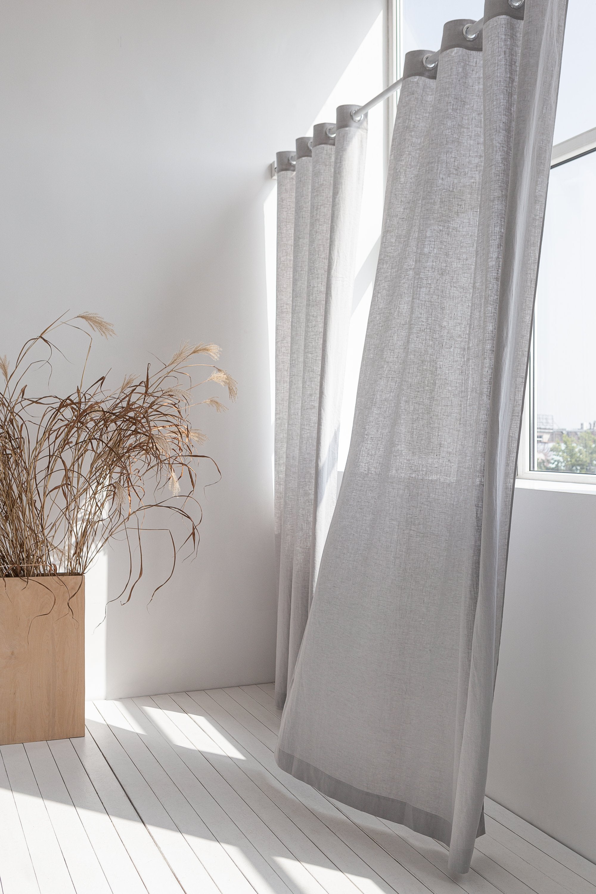 Light grey linen curtain with grommets from Magenta Sugarplum, showcasing a stylish home decor window treatment.