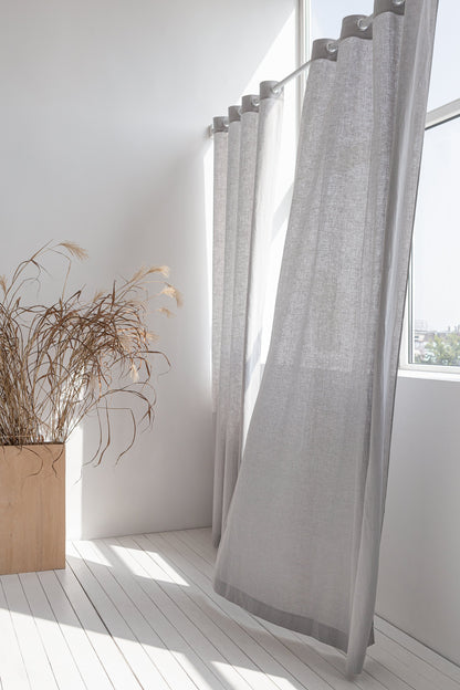 Light grey linen curtain with grommets from Magenta Sugarplum, showcasing a stylish home decor window treatment.