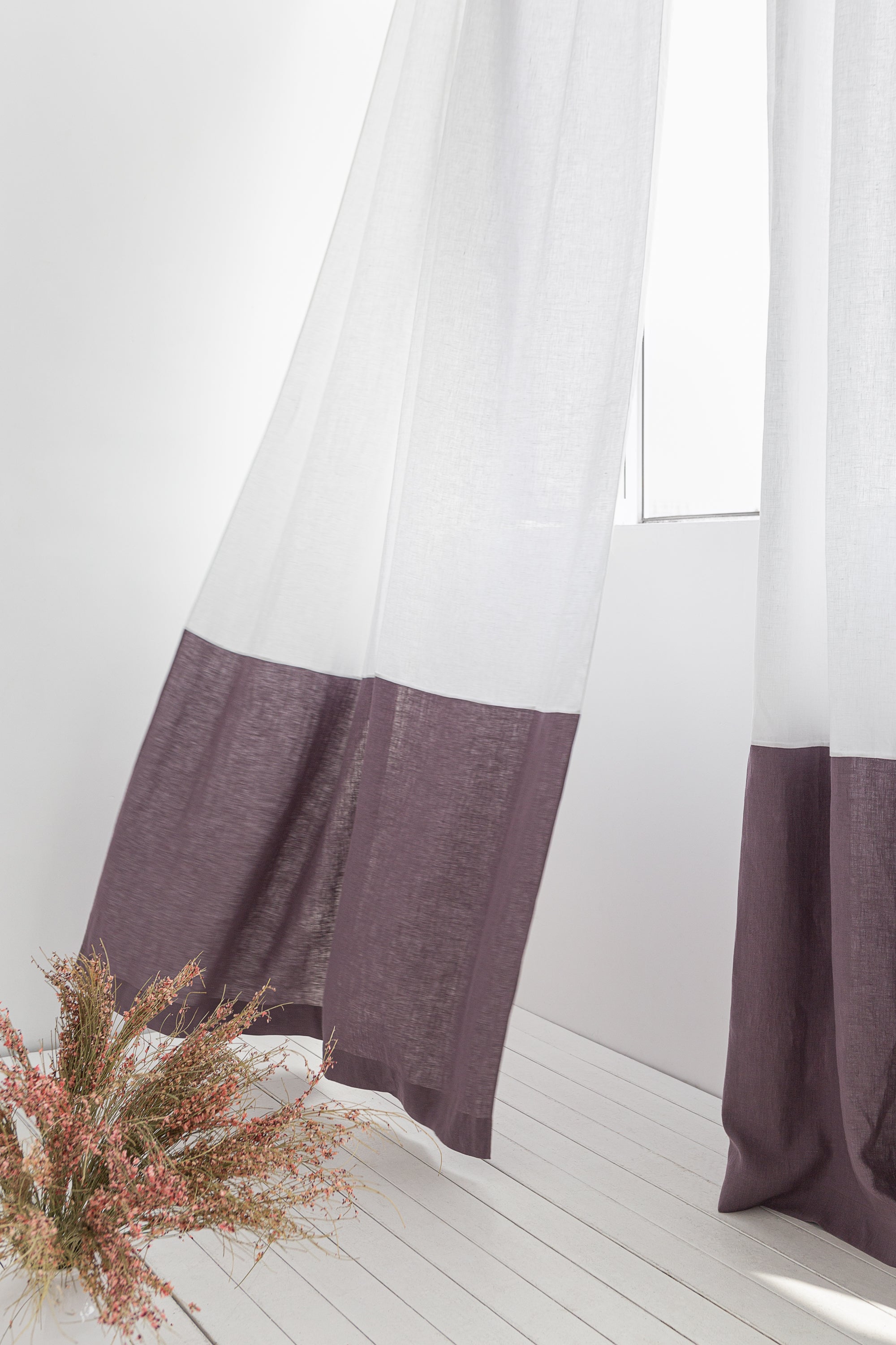 White and pastel plum linen curtains with tape, two-tone home decor by Magenta Sugarplum, shown hanging in a window.