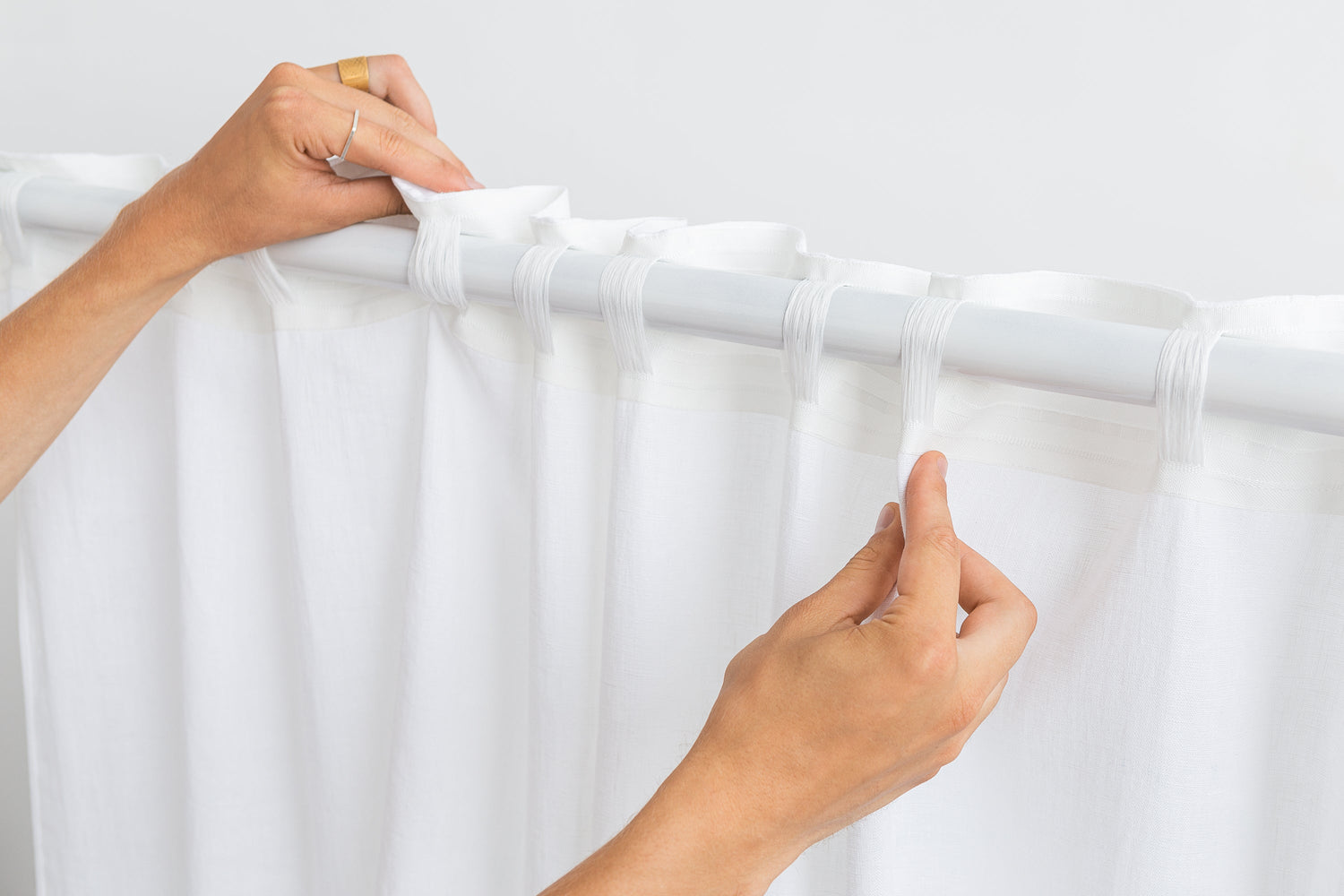 White and pastel plum linen curtains with tape, two-tone home decor by Magenta Sugarplum shown in the image.