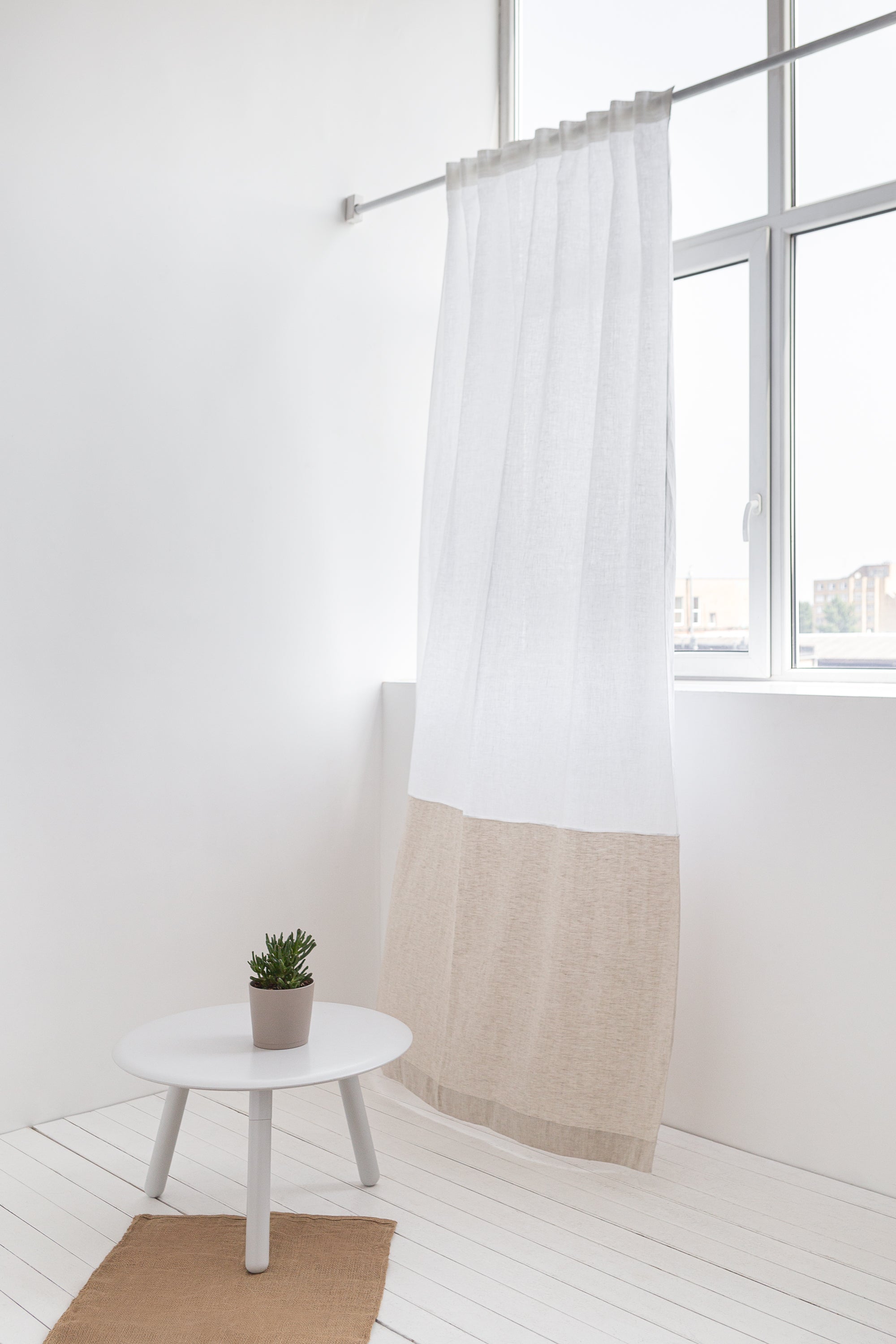 White and pastel plum linen curtains with tape, two-tone home decor by Magenta Sugarplum, shown hanging in a window.