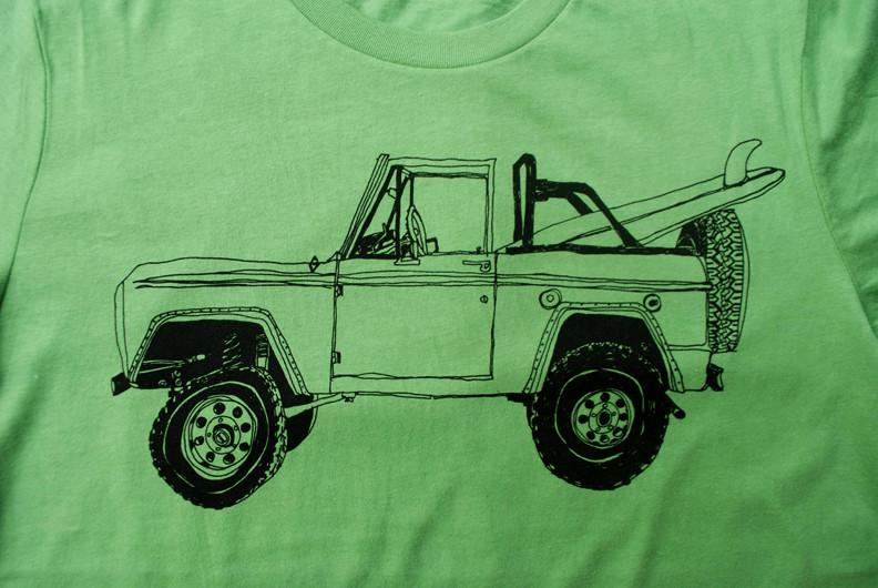 Pink Simba Bronco Surf Trip Leaf Green T-shirt featuring a relaxed fit with surf-inspired leaf graphic on soft fabric.