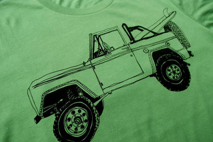 Pink Simba Bronco Surf Trip Leaf Green T-shirt featuring a vibrant surf-themed design on soft cotton fabric.
