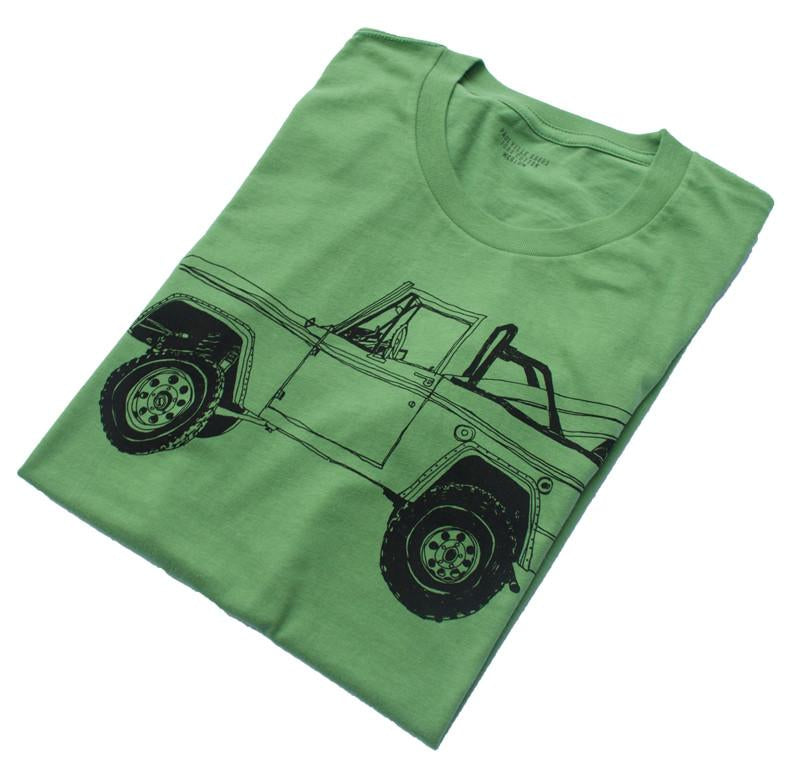Pink Simba Bronco Surf Trip Leaf Green T-shirt featuring a tropical leaf print on soft fabric.