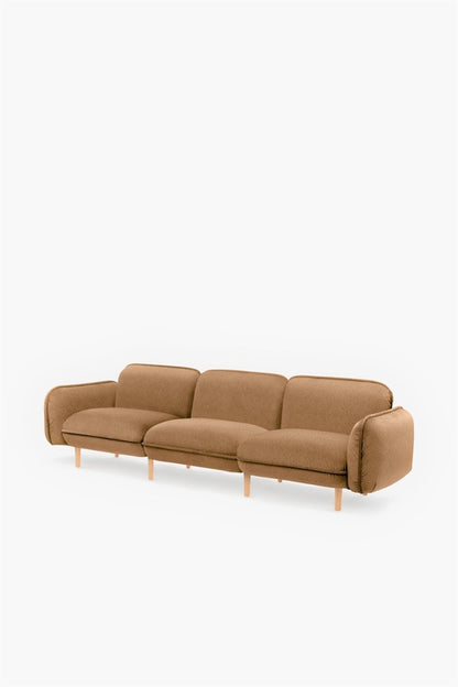 Mustard bean-shaped sofa by Aquamarine Poppy, modern furniture piece with plush cushions and stylish design.