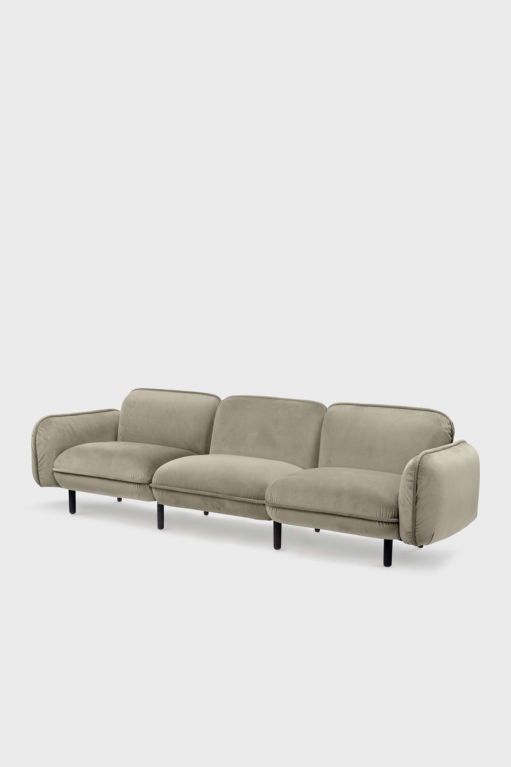 Beige Aquamarine Poppy Bean sofa with plush cushions and modern design, placed in a living room setting.