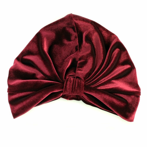 Burgundy stretch velvet turban by Cyan Ismene, a stylish haircare accessory with a full wrap design for comfortable wear.