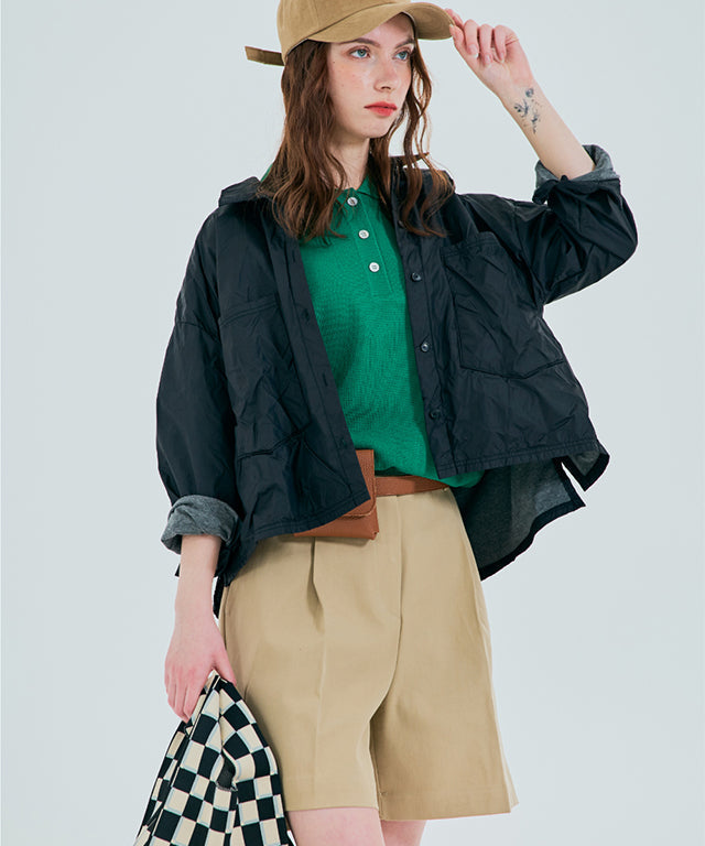 Beige BENECIA 12 Butter Bermuda Shorts by Amethyst Lucy, displayed on a hanger, showing the casual, tailored fit and fabric texture.