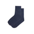 Navy boys anklet socks by Raspberry Pallas, styled with denim jeans, shown on a child for casual wear.