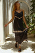 Black Shibori silk dress for women by Violet Apollo, featuring elegant draping and intricate fabric pattern.
