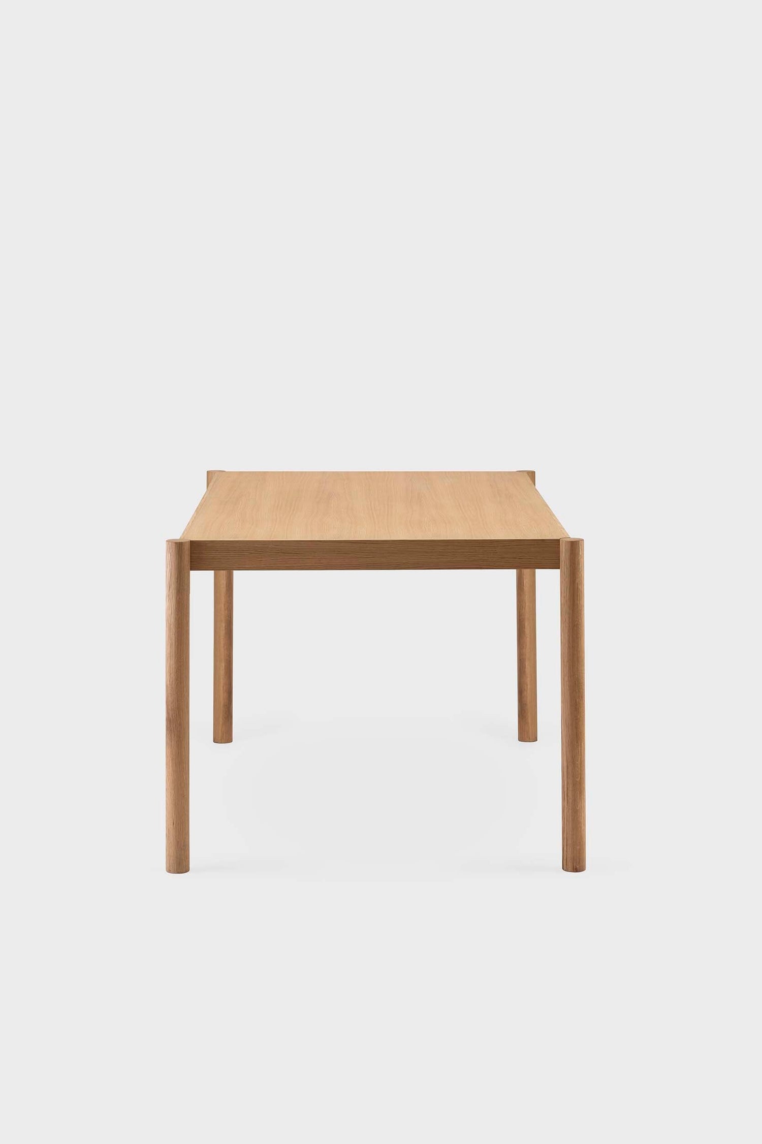 Natural wood Citizen dining table by Aquamarine Poppy, showcasing a modern furniture design with a smooth tabletop and sturdy legs.