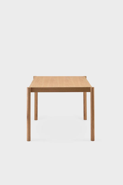 Natural wood Citizen dining table by Aquamarine Poppy, showcasing a modern furniture design with a smooth tabletop and sturdy legs.