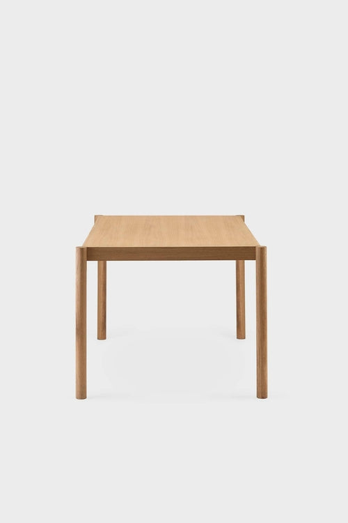 Aquamarine Poppy Citizen dining table with a sleek wooden surface and sturdy legs, ideal for modern dining rooms.