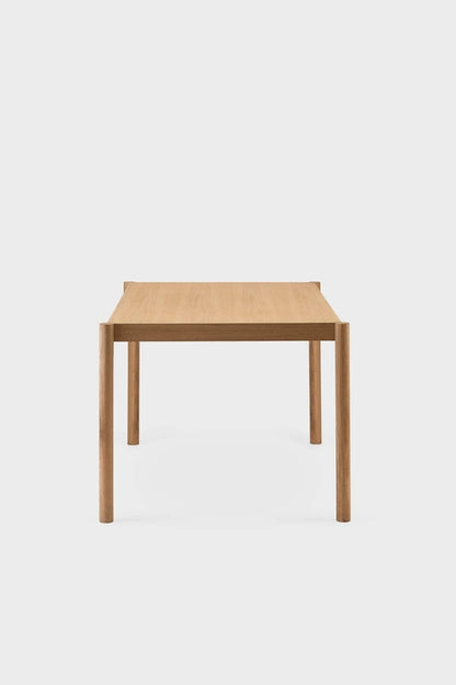 Aquamarine Poppy Citizen dining table with a sleek wooden surface and sturdy legs, ideal for modern dining rooms.