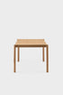 Aquamarine Poppy Citizen dining table with a sleek wooden surface and sturdy legs, ideal for modern dining rooms.
