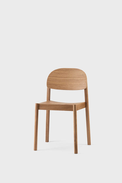 Aquamarine Poppy Citizen dining chair with wooden legs and upholstered seat, showing a modern furniture design.