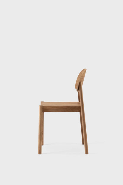 Aquamarine Poppy Citizen dining chair with wooden legs and upholstered seat, showcasing modern furniture design.