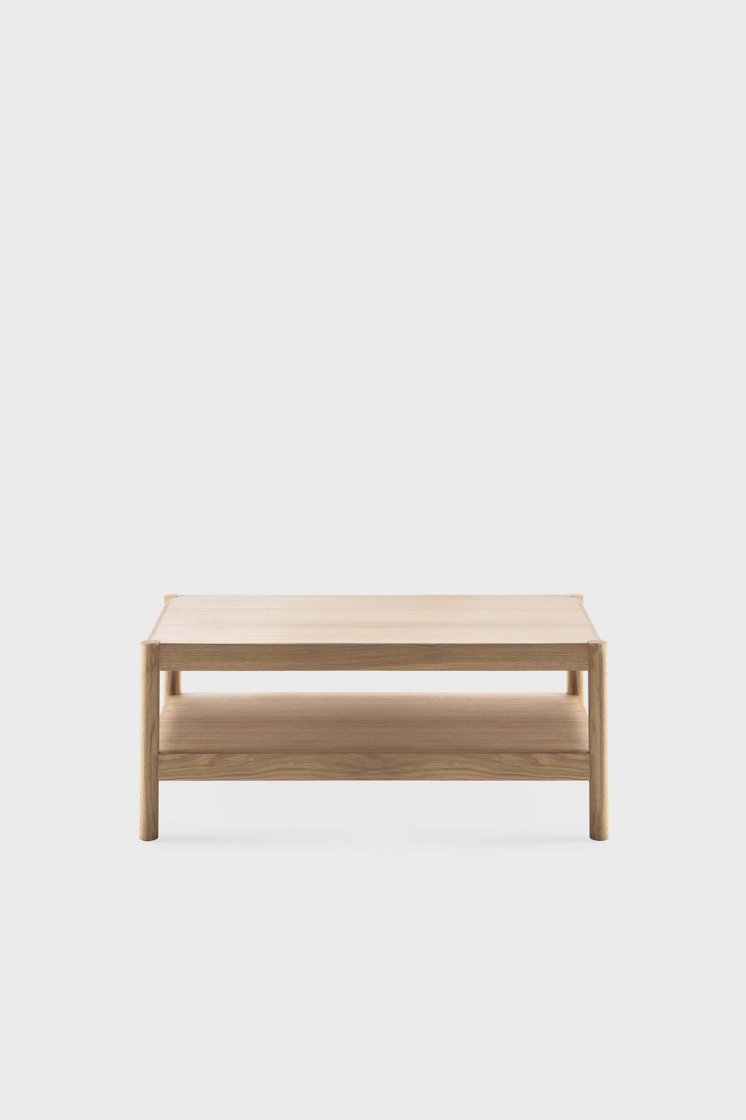 Natural oak Citizen side table by Aquamarine Poppy, featuring a sleek, modern design with a smooth surface and sturdy legs.