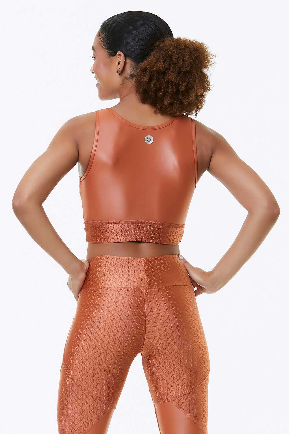 Orange blossom cropped sports bra by Red Medusa, activewear with supportive fit, shown from the back in this image.