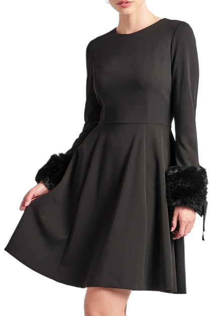 Close-up of Peach Dionysus Caroline Dress featuring long sleeves, fit and flare silhouette, black fabric, and faux fur details.