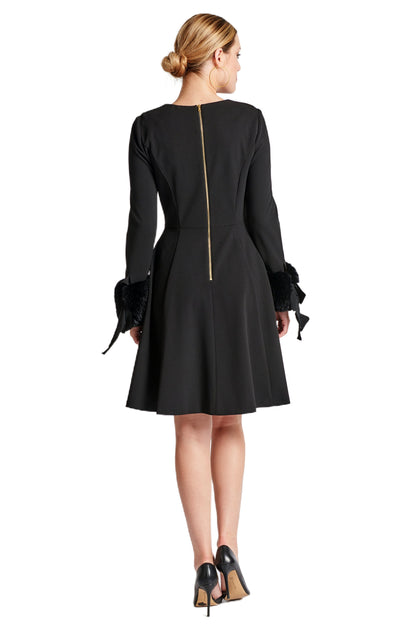Back view of Peach Dionysus Caroline Dress, a black long sleeve fit and flare dress with faux fur details.