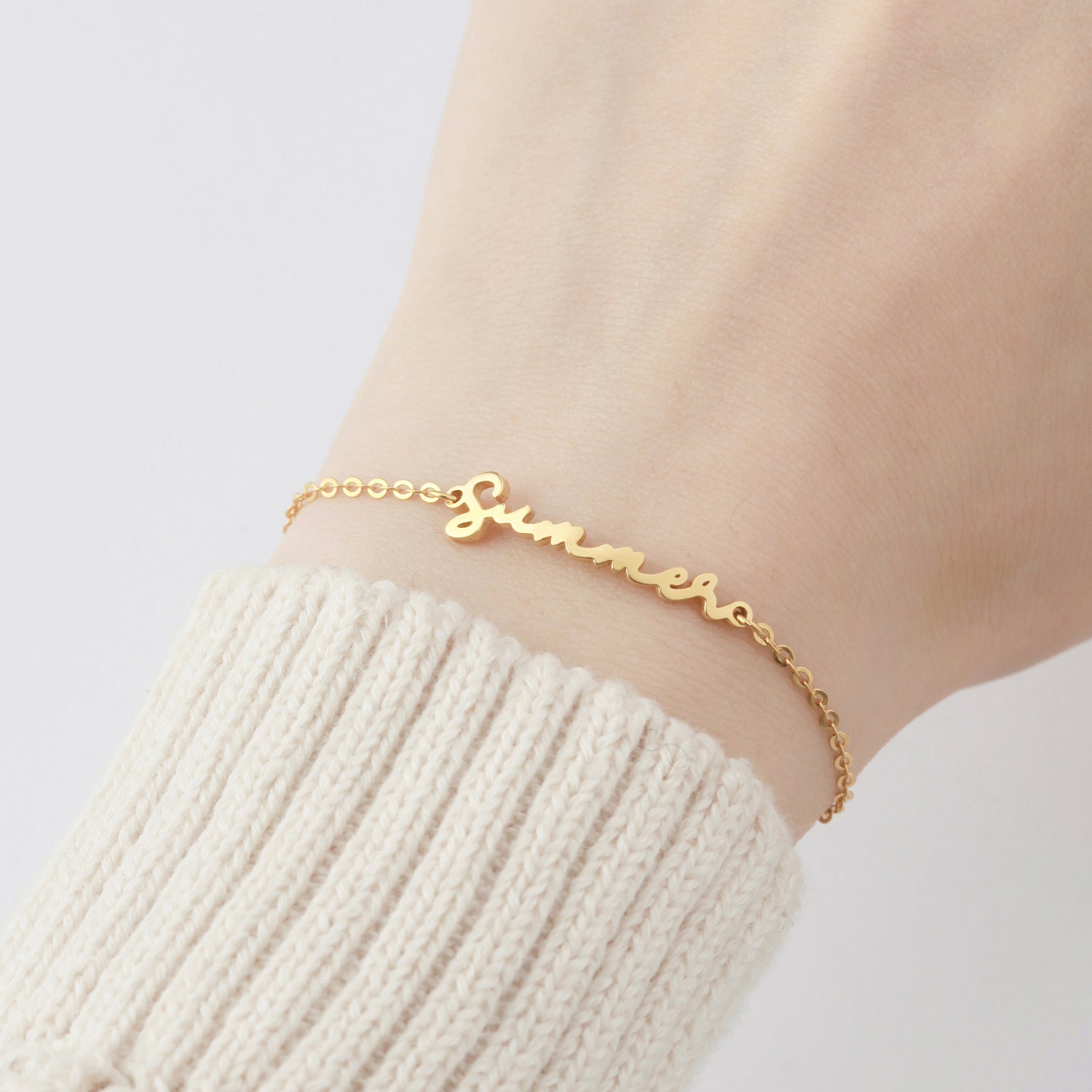 Green Millie cursive name bracelet, personalized jewelry for her, featuring elegant script and custom name design.