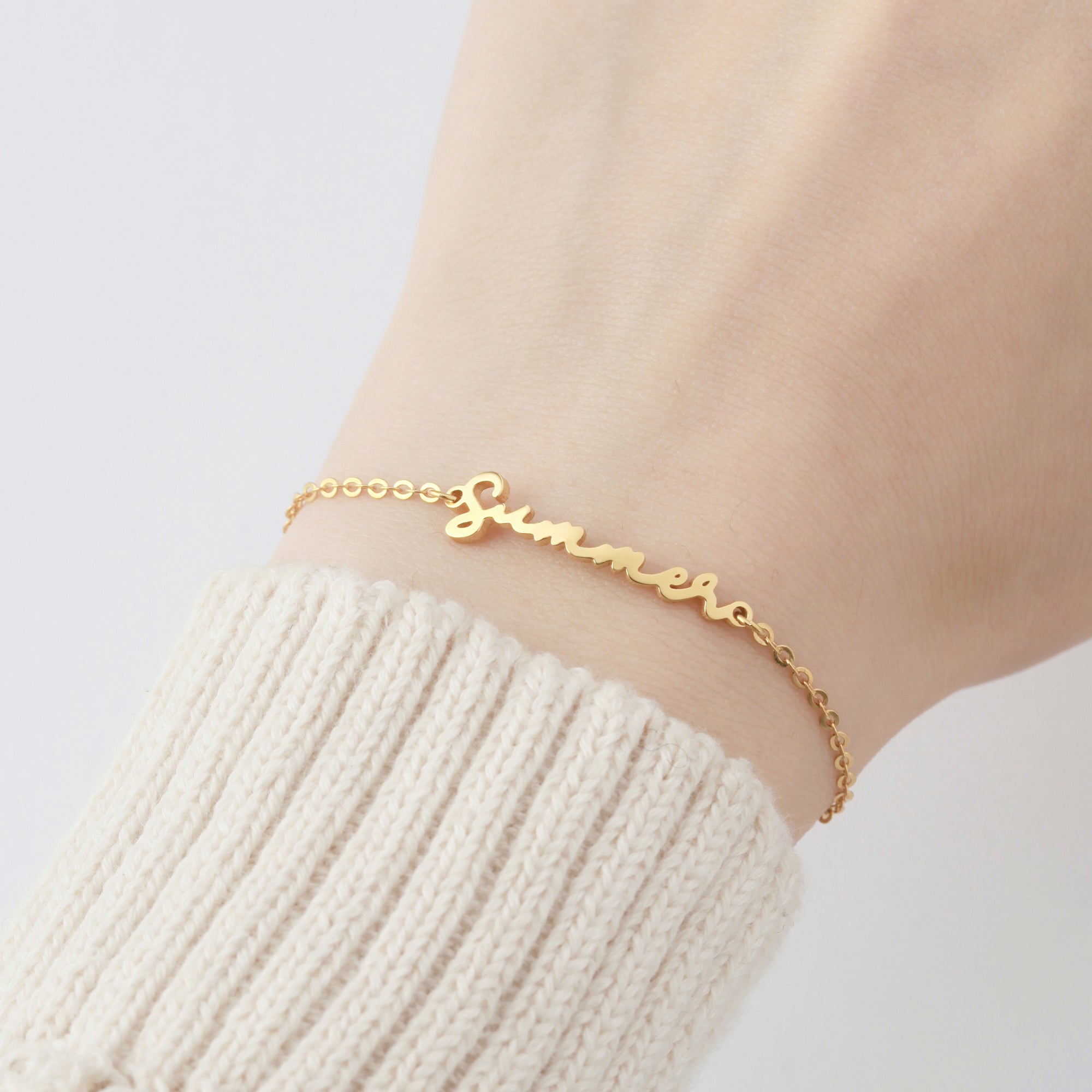 Green Millie cursive name bracelet, personalized jewelry for her, featuring elegant script and custom name design.