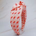 Fuchsia Hercules satin headband with cherry and bow design, featuring vibrant red cherries and elegant satin fabric.