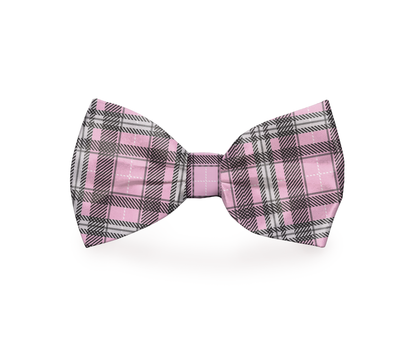 Pink plaid dog bow tie by Plum Semele, stylish petwear accessory for dogs, shown on a mockup with a classic pattern.
