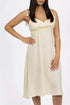 Cream pet dress by Burgundy Perses featuring a midi length, V-neck, and spaghetti straps, suitable for stylish pet wear.
