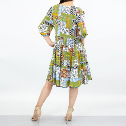 Green flare bottom 3/4 sleeve dress by Yellow Hera, showcasing a stylish and flowy design perfect for casual or semi-formal wear.