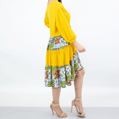 Three-tiered color block yellow dress by Yellow Hera, showcasing vibrant yellow fabric with layered design and stylish neckline.