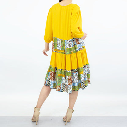 Yellow Hera three-tiered color block dress in yellow, featuring a stylish layered design for a modern clothing look.