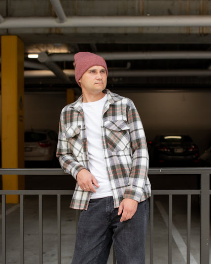 Azure Arrowwood HAAKWEAR knit cuffed beanie in rusty burgundy, featuring a cozy knit design and cuffed style for warmth and style.