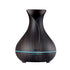Devanti aroma diffuser with dark wood finish, 400ml capacity, for aromatherapy, in a home and garden setting.