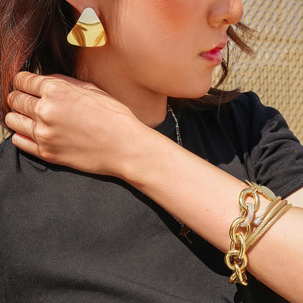 Lavender Phoebe curved triangle earrings in gold-tone jewelry with sleek, modern design for stylish accessory.