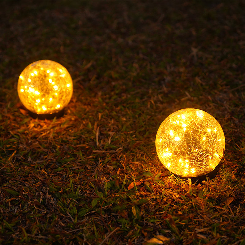 Pink Iolaus outdoor solar crack bottle 20-light waterproof decorative lighting setup in a garden setting