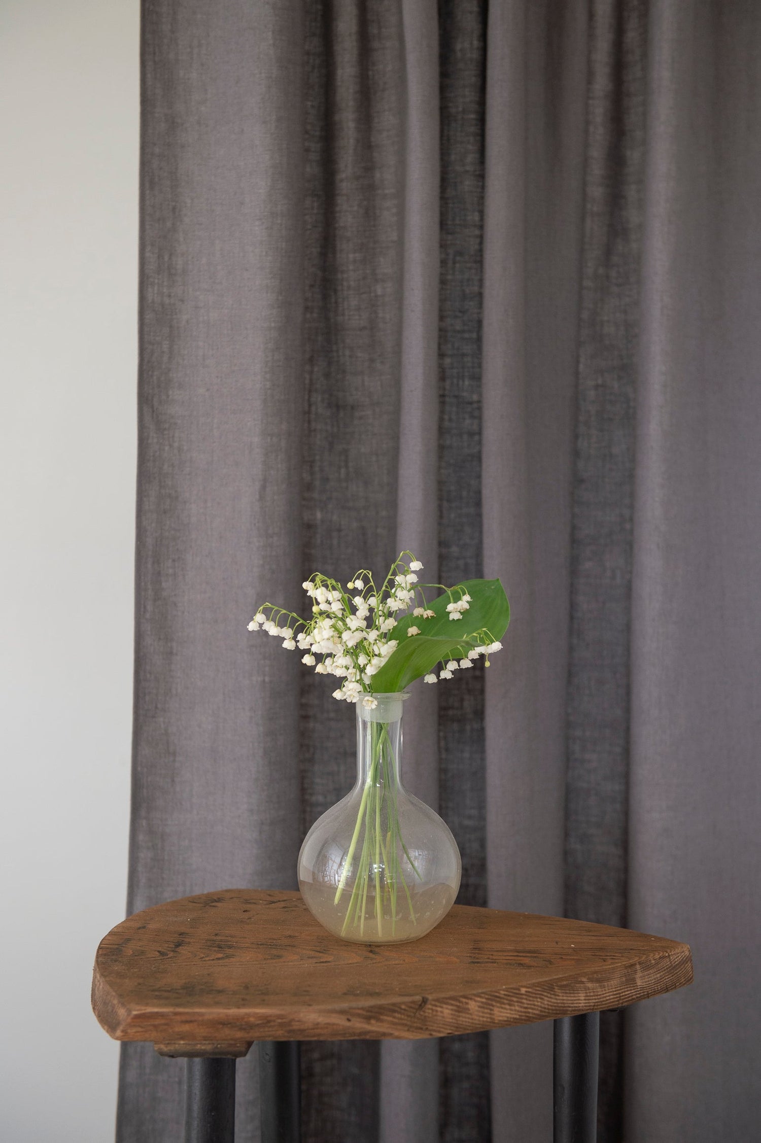 Grey linen curtain with rod pocket, Magenta Sugarplum home decor, showing the fabric texture and hanging style.
